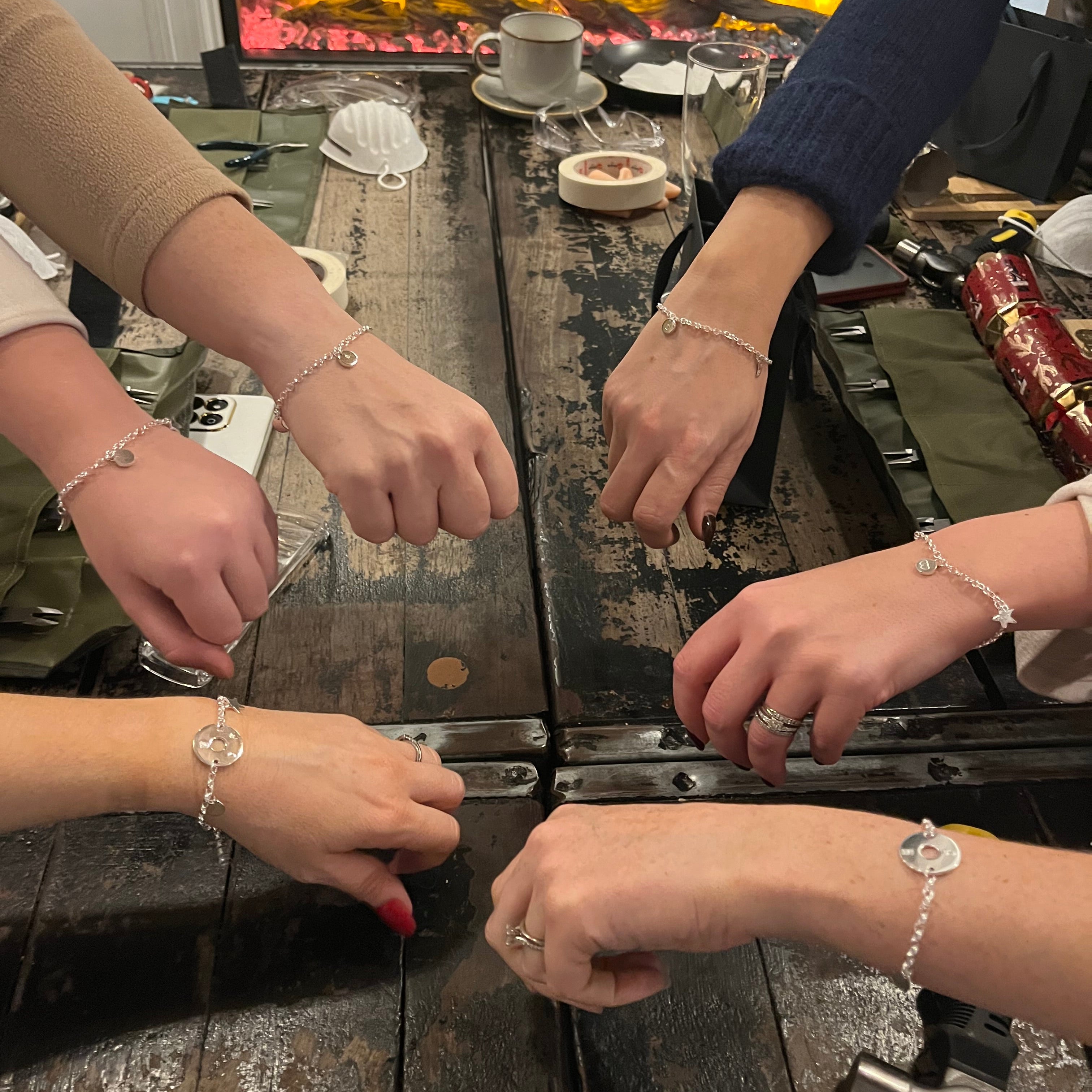 Silver bracelet making workshop picture of attendees with their bracelets